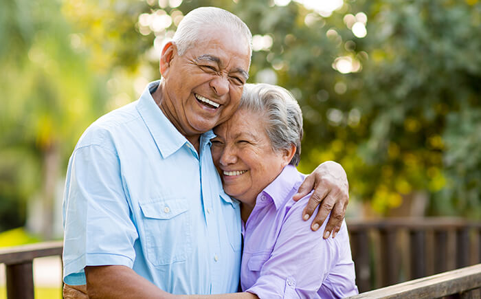 older couple hugging and smiling